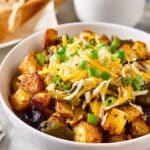 Make-Ahead Breakfast Bowls with Roasted Potatoes, Eggs, and Cheddar Recipe