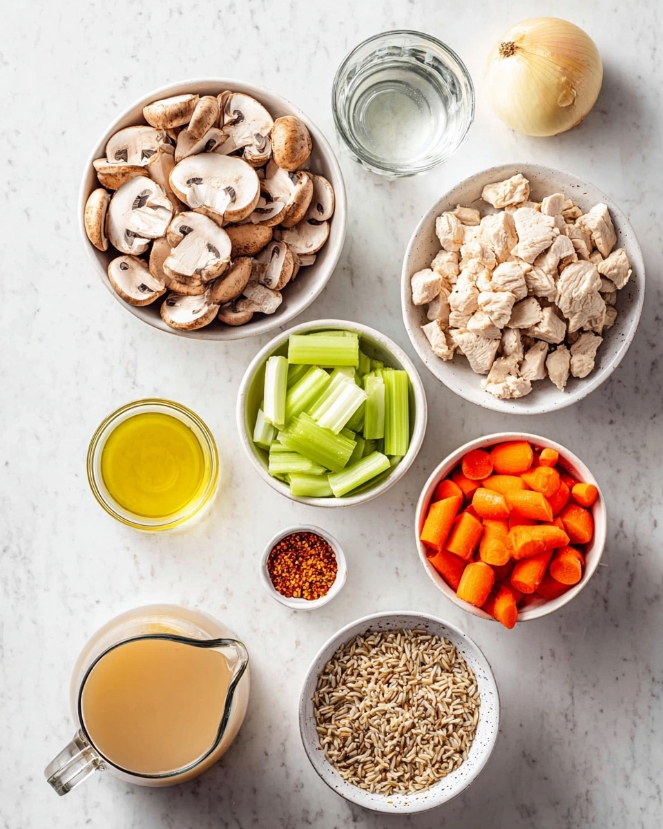 Top view of several small white bowls placed on a white marbled surface. One bowl is filled with sliced brown mushrooms showing smooth, rounded edges. Another bowl holds bright orange carrot slices and fresh light green celery pieces side by side. A third bowl contains small, light beige chunks of cooked chicken. A fourth bowl has a mix of uncooked wild and brown rice grains. Around the bowls, there is a small glass jug of clear water, a small glass bowl with yellow olive oil, a clove of garlic, a golden-yellow whole onion, a small container of red chili flakes, a white pitcher with a foamy light beige liquid, and a larger glass measuring jug filled with light golden broth. Photo taken with an iphone --ar 4:5 --v 7