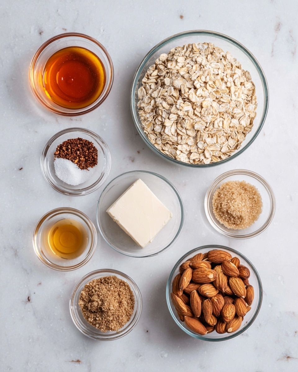 The image shows eight clear glass bowls placed on a white marbled surface. The largest bowl, in the center right, holds light beige rolled oats with a rough texture. Surrounding it are seven smaller bowls: in the top left is a bowl of golden amber syrup, below it a small bowl with a dark brown powder mixed with white granules, next below that a tiny bowl of light amber liquid, at the bottom center a bowl with finely ground brown flaxseeds, at the top center a small bowl with a square piece of white butter, to the right of the oats a bowl filled with light brown packed sugar, and at the bottom right a bowl full of whole raw almonds with smooth brown skins. The bowls are neatly arranged on the white marbled surface with soft, natural lighting. photo taken with an iphone --ar 4:5 --v 7