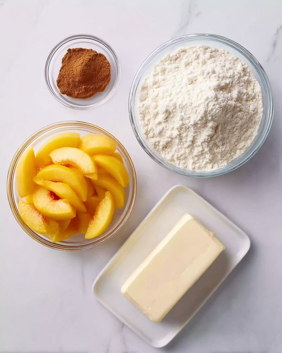 The image shows four clear glass and white dishes placed on a white marbled surface. In the top left, a small clear glass bowl contains a small amount of brown cinnamon powder. Below it, a large clear glass bowl is filled with bright yellow peach slices arranged loosely. To the right of the peach bowl, a large clear glass bowl is heaped with white flour that looks soft and powdery. In the bottom right, a rectangular white plate holds a block of pale cream butter with smooth texture. The items are spaced evenly, showing clear textures and colors of each ingredient. Photo taken with an iphone --ar 4:5 --v 7