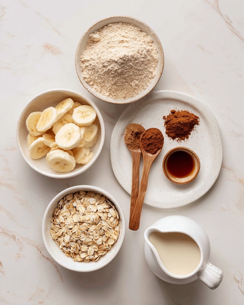 The image shows five separate white bowls and plates on a white marbled surface, each holding a different ingredient. The top bowl contains light beige vanilla protein powder with a powdery texture. To the left, a bowl is filled with pale yellow frozen banana slices in a rough circular layer. Below that, a bowl holds light brown rolled oats with a dry, flaky texture. On the right side, a white plate holds two wooden spoons: one has dark brown cinnamon powder, and the other holds dark amber vanilla liquid, both with a fine and smooth texture. At the bottom right, a white pitcher contains creamy almond milk. Photo taken with an iphone --ar 4:5 --v 7