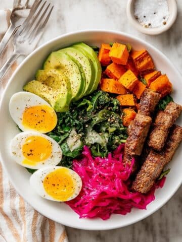 Savory Breakfast Bowl with Roasted Sweet Potatoes, Eggs, Sausage, and Sauerkraut Recipe
