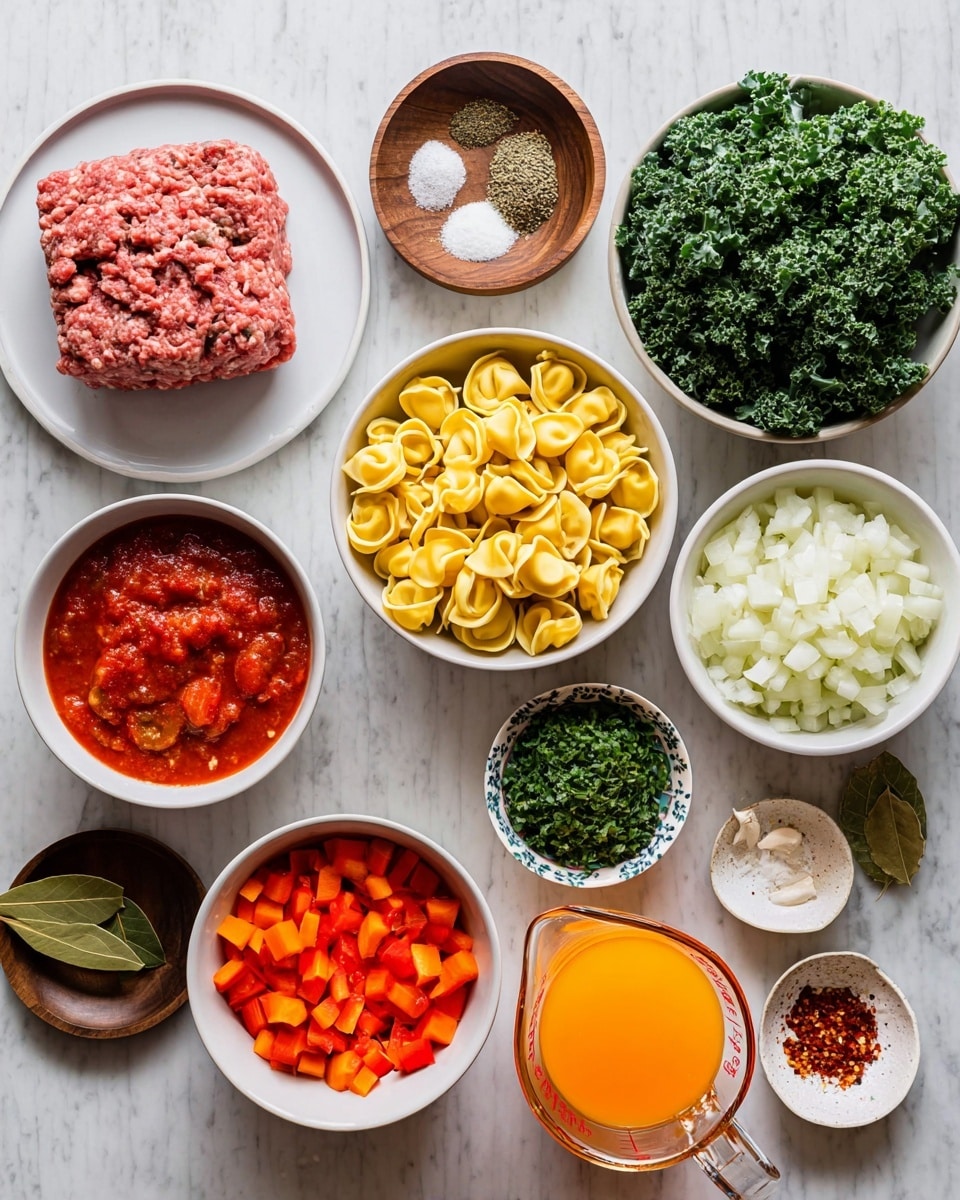 The image shows many ingredients neatly arranged on a white marbled surface. There is a white plate with a large block of raw ground meat in the top left, and next to it, two small wooden bowls each holding ground black pepper and dried herbs. Below these, a small wooden bowl with salt sits near a white bowl full of bright yellow tortellini pasta. Next to the pasta is a white bowl filled with diced white onions, and near it is another white bowl with diced red bell peppers. A small clear glass bowl contains diced orange carrots near the bottom right. In the middle, a white bowl holds chunky red canned tomatoes, and a glass measuring cup filled with orange liquid is just to the right of it. To the right of that, there is a small patterned bowl filled with minced garlic, a small white plate with a single bay leaf, and a small dark wooden bowl with red chili flakes. A larger white bowl full of chopped green kale is on the far right, and above it, a white bowl with chopped fresh green herbs. The overall look is clean and colorful with a variety of fresh and dry ingredients. Photo taken with an iphone --ar 4:5 --v 7