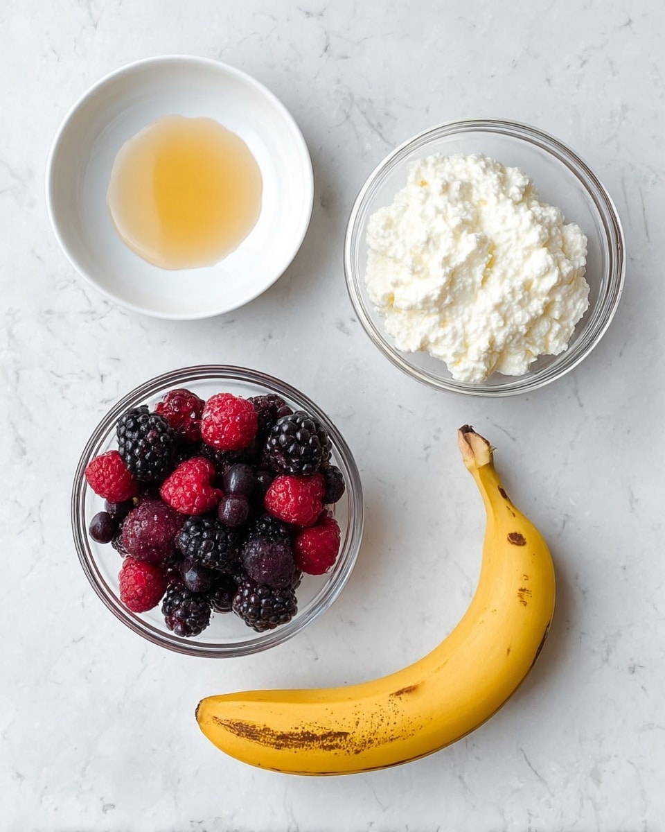 The image shows four separate items on a white marbled surface: a white plate with a small amount of light golden honey in the center top left, a clear glass bowl filled with creamy white cottage cheese at the center top right, a clear glass bowl containing mixed frozen berries including blackberries, raspberries, and blueberries at the bottom left, and a yellow banana with brown spots lying curved on the bottom right. The items are arranged neatly without touching. Photo taken with an iphone --ar 4:5 --v 7