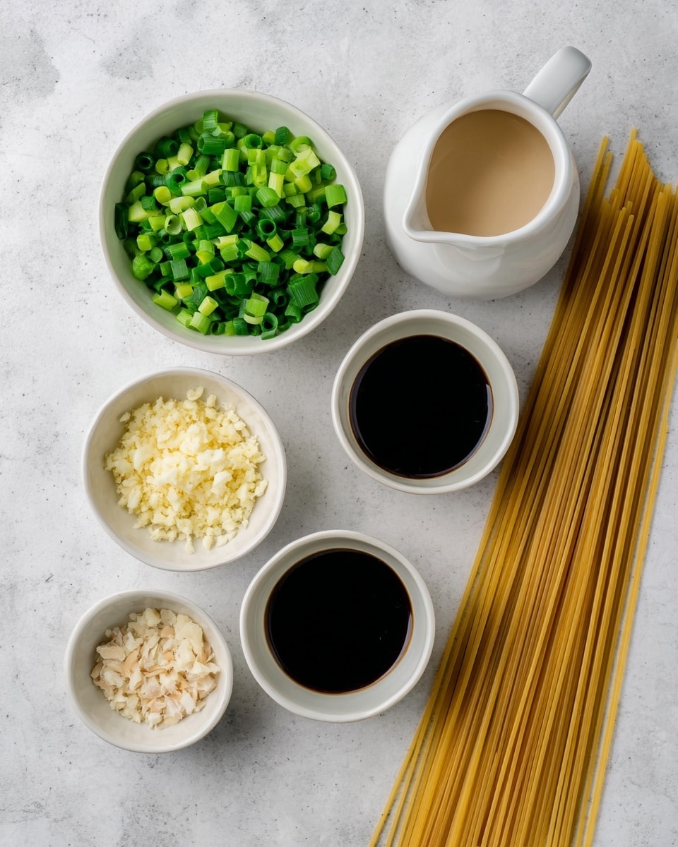 The image shows several small white bowls arranged on a white marbled surface, each filled with different ingredients. One bowl is filled with chopped green onions, another with finely minced garlic, and a third with dark soy sauce. There is also a white jug filled with a creamy, light-colored liquid, and a bundle of dry, uncooked spaghetti sticks lying next to the bowls. The colors contrast well, with the bright green onion pieces standing out against the pale garlic and the dark sauce. The overall scene is clean and simple, ready for cooking. photo taken with an iphone --ar 4:5 --v 7