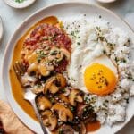 Loco Moco with Mushroom Gravy, Seared Beef Patties, and Fried Eggs Recipe