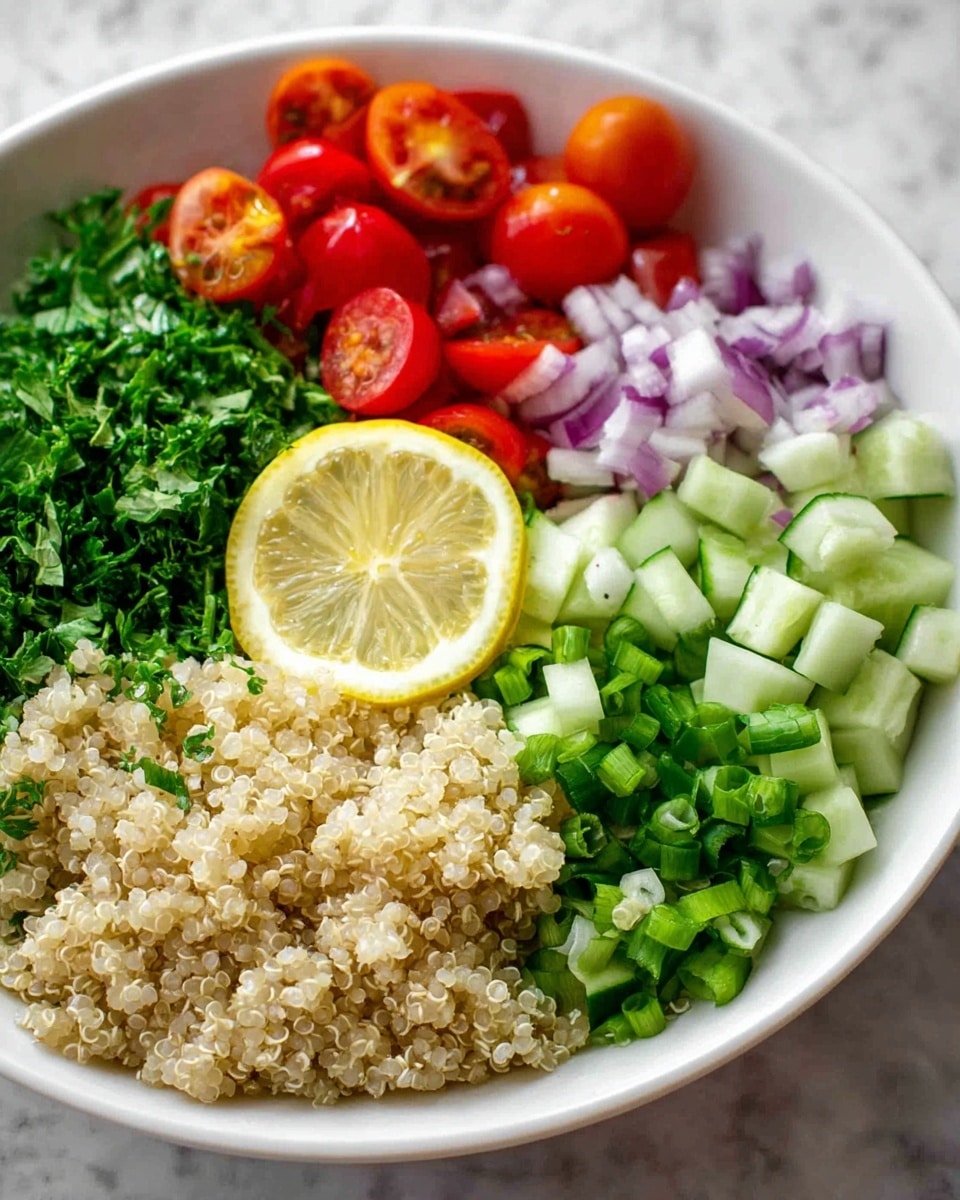 The image shows a white bowl filled with a colorful layered salad. At the bottom right, there is a large portion of light beige quinoa with a soft, grainy texture. Moving clockwise, there are finely chopped green onions with bright green rings and small pieces of darker green tops. Next to this, there are diced cucumbers in a light green color with a fresh, crisp look. At the top of the bowl, there are halved cherry tomatoes in a bright red color with juicy, glossy surfaces. On the left side, there is a pile of finely chopped fresh parsley in dark green. Below that, finely chopped red onion pieces add a light purple color. In the front center, there is a half lemon slice with a pale yellow color showing detailed pulp and rind. The bowl is placed on a white marbled surface. Photo taken with an iphone --ar 4:5 --v 7