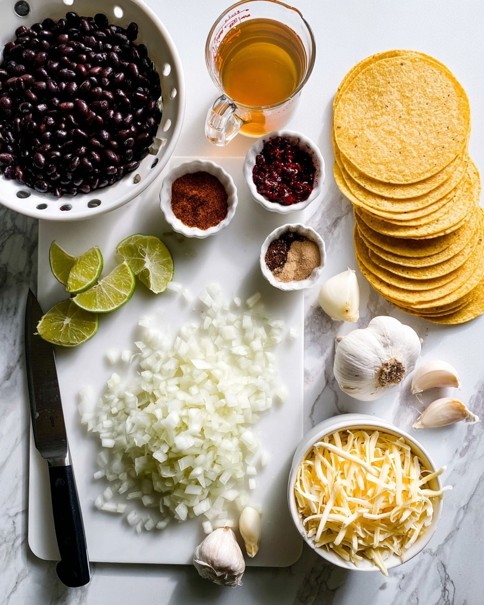The image shows a white cutting board placed on a white marbled surface. On the cutting board, there is a pile of finely chopped white onions in the center, with several lime wedges scattered around the top left side. A knife with a black handle rests diagonally on the lower left side of the board. To the right of the cutting board, there is a neat stack of yellow corn tortillas arranged in a slight arc. Near the bottom right corner, a white bowl is filled with shredded cheese, displaying a pale yellow and cream mix. Slightly above the bowl of cheese, a glass measuring cup holds a light brown liquid. On the left side of the cutting board, there is a white colander filled with black beans. Above that, a white dish holds several ground spices of red, brown, and green hues, and two small white ramekins contain dark red pastes or sauces. Cloves of garlic with papery white skins are scattered near the top right of the cutting board. The whole setup is bright with natural light highlighting the textures and colors. photo taken with an iphone --ar 4:5 --v 7
