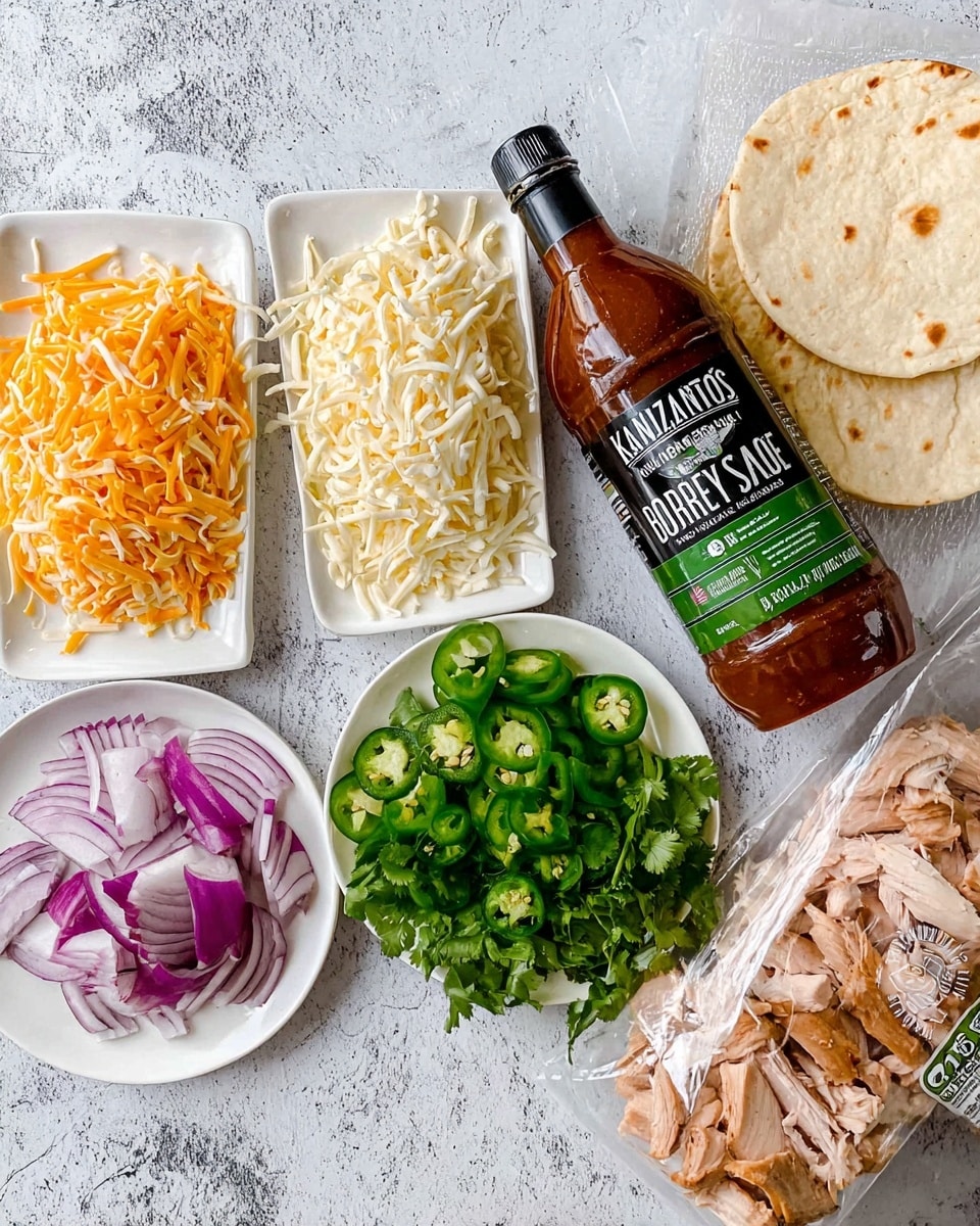 The image shows four white plates arranged on a white marbled surface. One plate holds shredded white and orange cheese side by side, the second plate has sliced red onions, green jalapeños, and a small bunch of fresh green cilantro on top. The third plate contains pieces of cooked light brown chicken. Next to the plates is a bottle of brown BBQ sauce labeled