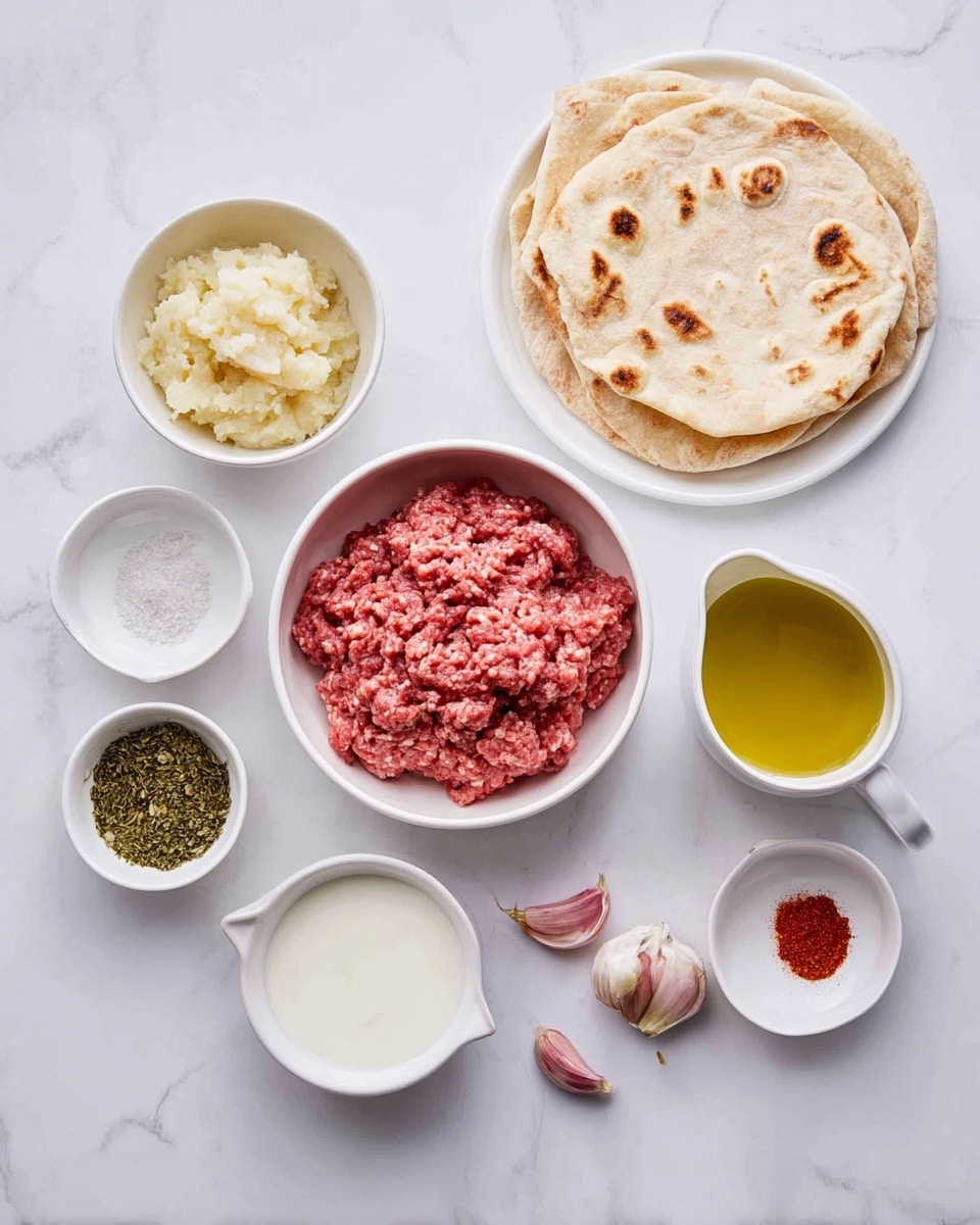 A white bowl in the center holds raw red ground meat with a slightly textured surface. Surrounding it are smaller white bowls arranged in a loose circle: one contains a pale yellowish mashed onion, another has smooth white yogurt or cream, another has golden yellow olive oil in a small pitcher, one bowl holds coarse white salt, another has dried green herbs, and one more has bright red ground spice. Near the bottom center are three cloves of garlic with a light pinkish skin. To the top right, two light golden flatbreads with darker toasted spots are stacked on a white plate. All items are placed on a white marbled surface. Photo taken with an iphone --ar 4:5 --v 7