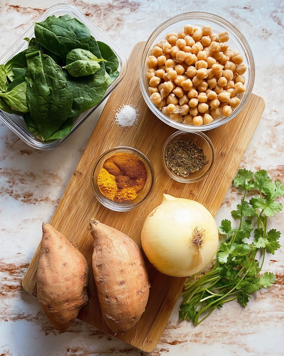 A wooden board holds five ingredients arranged neatly on a white marbled surface: two rough textured, light brown sweet potatoes at the bottom, a smooth light yellow onion with dried roots on the right, a small clear glass bowl of bright yellow, orange, brown, and green powdered spices above the onion, and a larger clear glass bowl full of pale beige chickpeas to the left. In the top left corner, a clear plastic container filled with fresh dark green spinach leaves sits partially visible. Fresh green cilantro sprigs with delicate leaves rest next to the board on the right side. Photo taken with an iphone --ar 4:5 --v 7