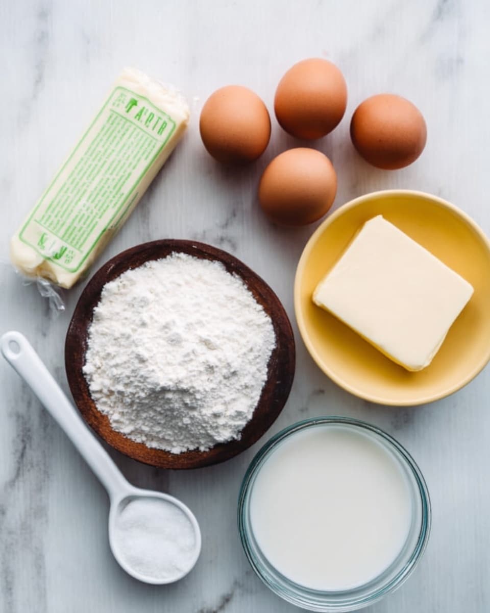 The image shows seven raw ingredients arranged neatly on a white marbled surface. There are three brown eggs placed in a small cluster, a stick of wrapped butter with green text next to them, and a small yellow bowl filled with white sugar. Nearby, a white scoop full of white flour is placed along with a small dark wooden bowl holding salt. Two clear glass bowls contain a liquid, one likely milk and the other water. Everything is laid out in a simple, clean way with soft natural light, emphasizing the fresh ingredients photo taken with an iphone --ar 4:5 --v 7
