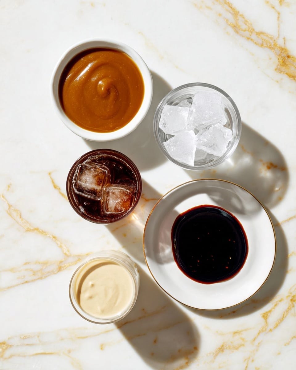 The image shows five small containers on a white marbled surface with gold streaks. In the top left corner, there is a small white bowl filled with thick, smooth, caramel-colored sauce. To the right of it, a clear glass bowl holds several medium ice cubes topped with coarse white salt. Below the bowl with salt, another clear glass holds a dark brown liquid with ice cubes visible inside. In the bottom left corner, a small glass bowl contains a smooth, creamy pale yellow liquid. Between the caramel sauce and creamy liquid bowls, there is a white plate with a dark brown, almost black, glossy sauce spread thinly in the center. Soft shadows fall around the containers. Photo taken with an iphone --ar 4:5 --v 7