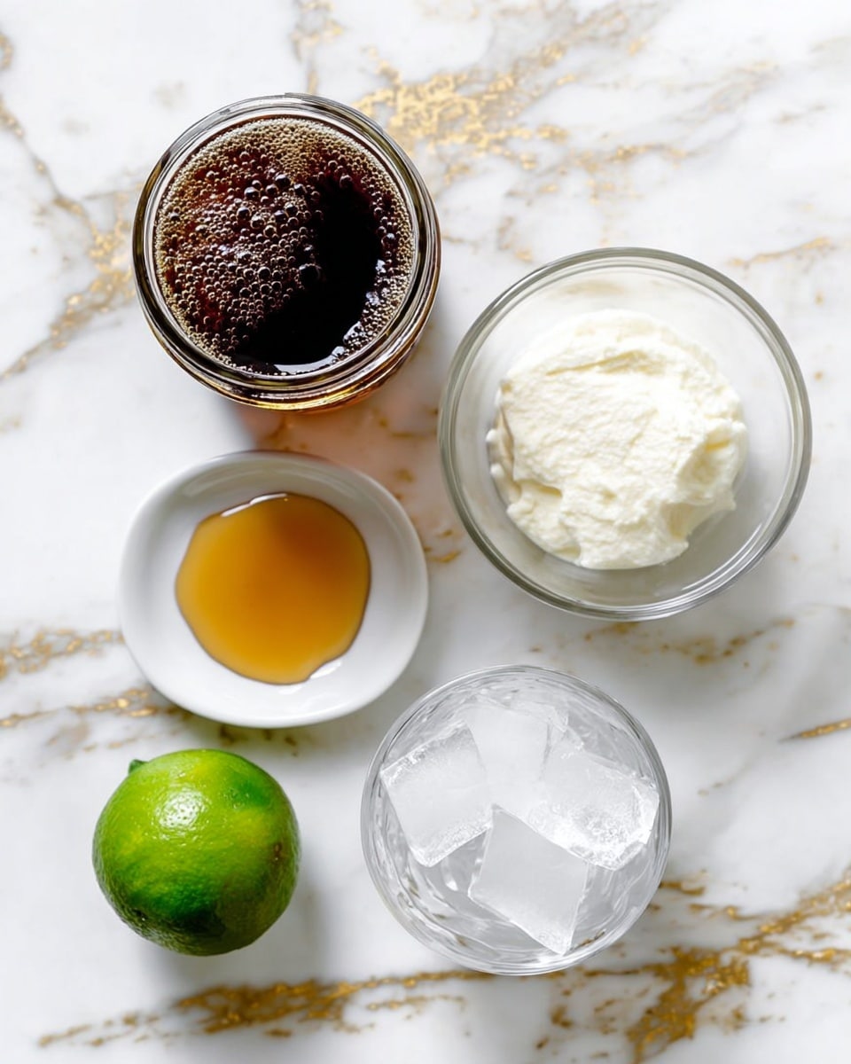 A top view of five ingredients arranged on a white marbled surface with gold streaks: a glass jar of dark brown fizzy soda with bubbles on top, a small white plate with a pool of golden honey, a clear glass cup filled with white cream, a clear bowl filled with ice cubes, and a bright green lime placed near the bottom left corner, all spaced out clearly and evenly. photo taken with an iphone --ar 4:5 --v 7